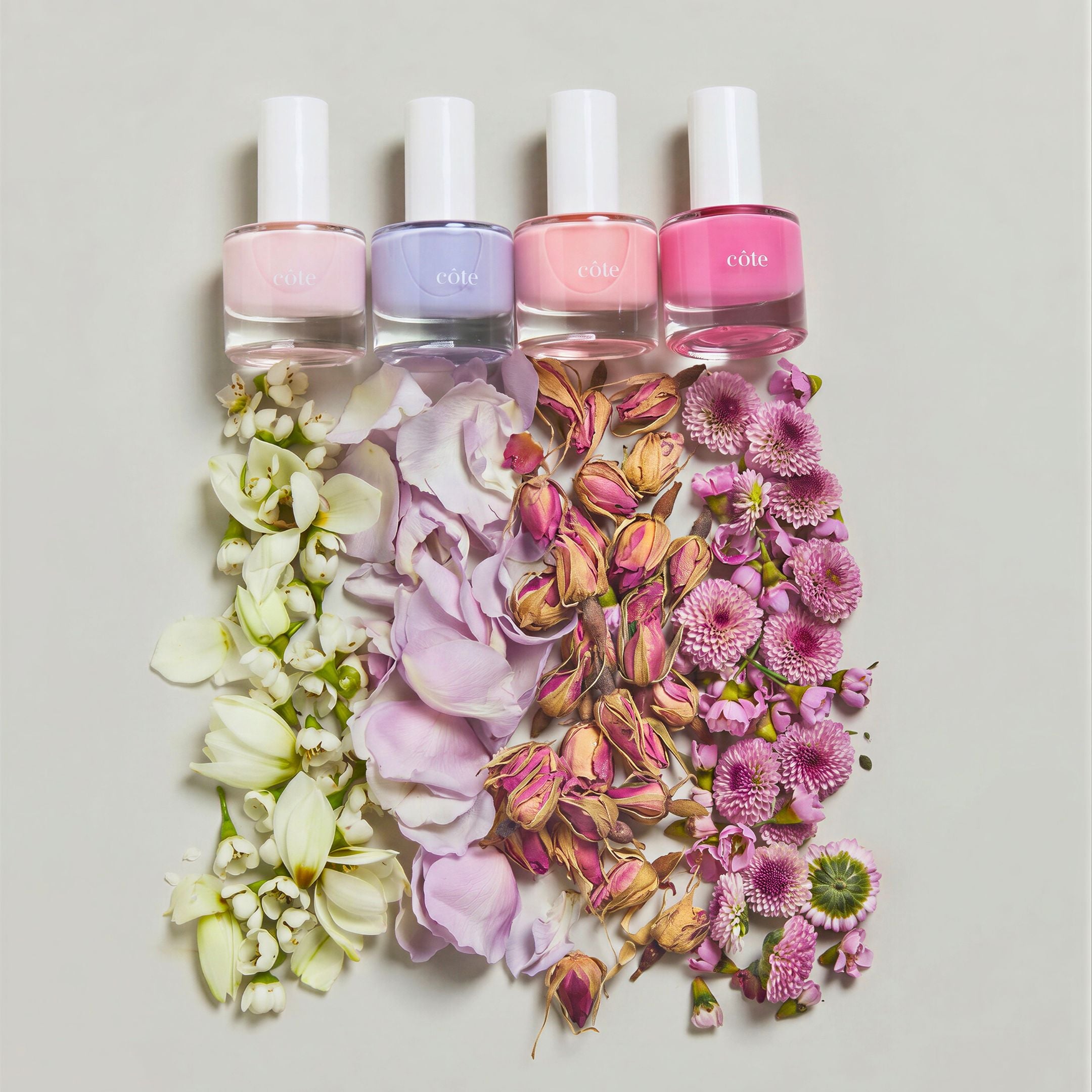 Côte Beauty Color Crush Nail Polish Set Non-Toxic Nail Polish Collection, bottles with flower petals. 