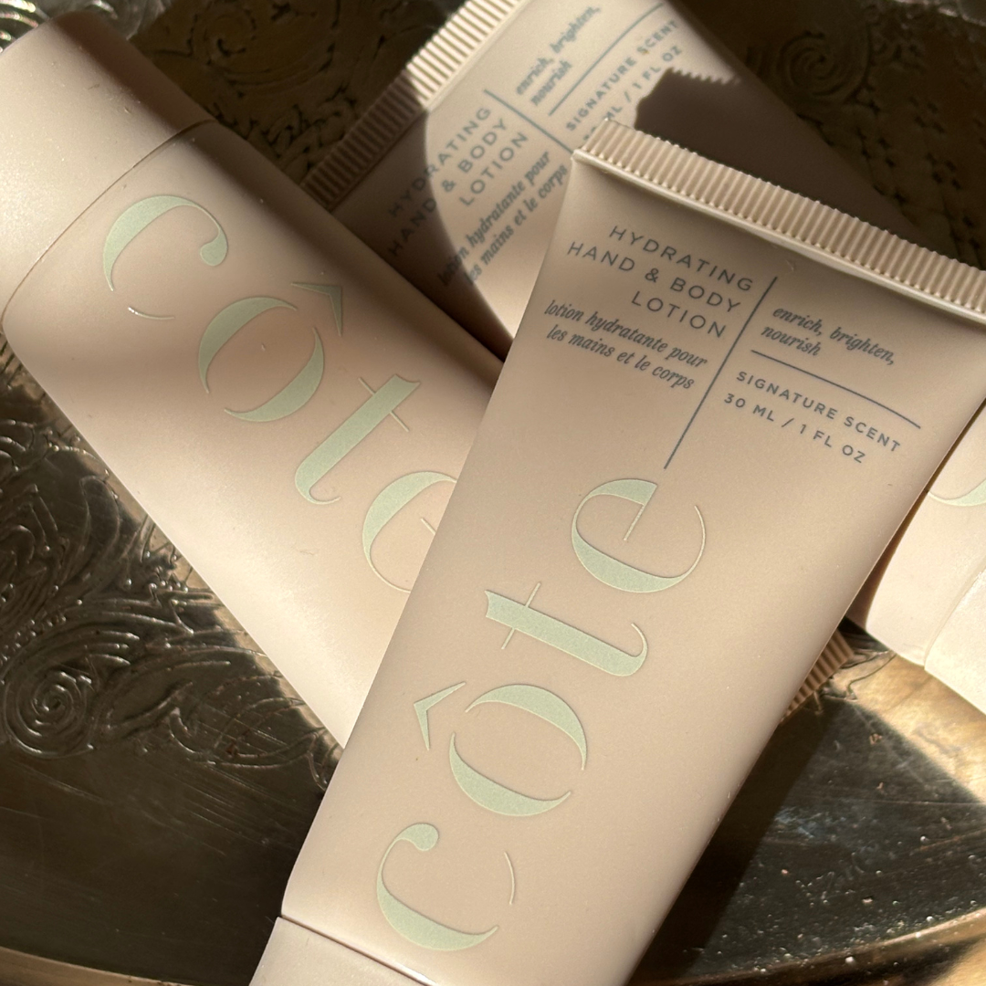 Mini Côte hydrating hand and body lotion packaging on a textured surface