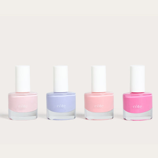 Côte Beauty Color Crush Nail Polish Collection, Including Moonbeam Soft Blush Pink , Sugar Côte Soft Lavender, Pink Clouds Sheer Petal Blush and Hotshot True Bright Pink Non-Toxic Nail Polish bottles.